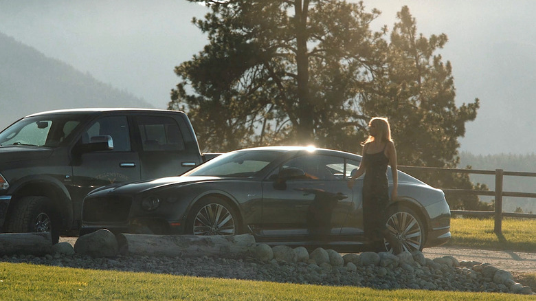 Beth getting out of her Bentley Continental GT