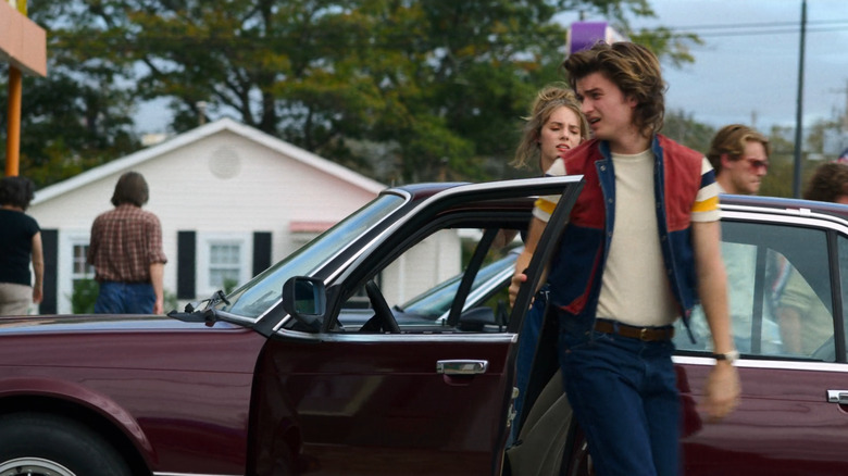 Steve Harrington and Robin Buckley exit Steve's BMW