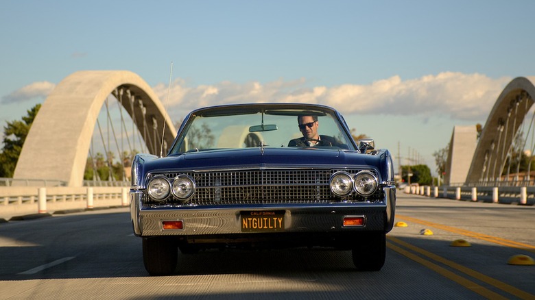 Mickey Haller driving his blue 1963 Lincoln Continental