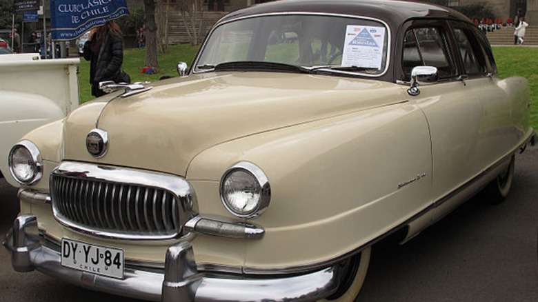 A tan 1951 Nash Statesman parked outdoors.