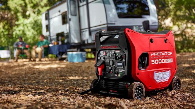 PREDATOR 5000 Watt Dual-Fuel SUPER QUIET Inverter Generator with camper in background