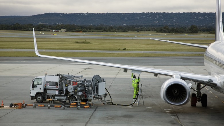 a Boeing 747 jet refueling on the ramp