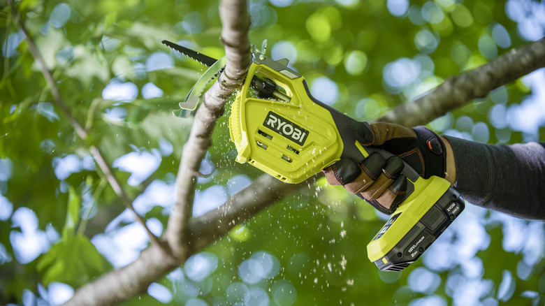 Ryobi Reciprocating saw cutting a branch