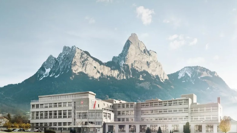 Victorinox Facility In Switzerland With Mountain Peak Backdrop