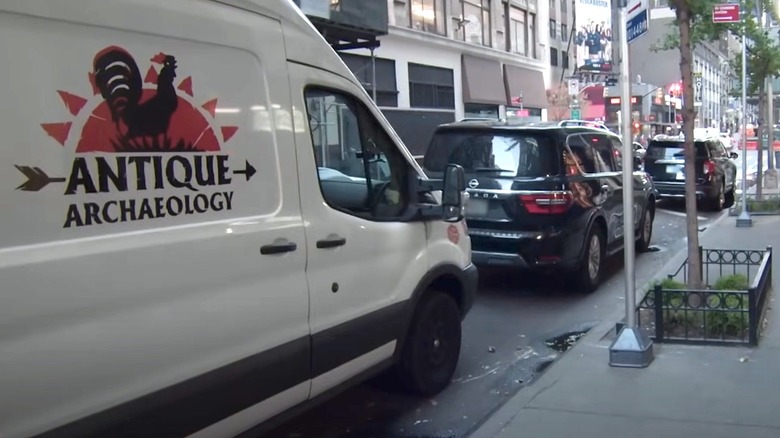 Antique Archaeology van parked on curb in American Pickers