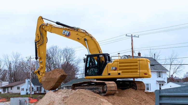 Caterpillar excavator moving dirt