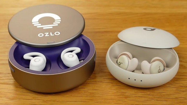 Ozlo Sleepbuds sitting on a wood table.