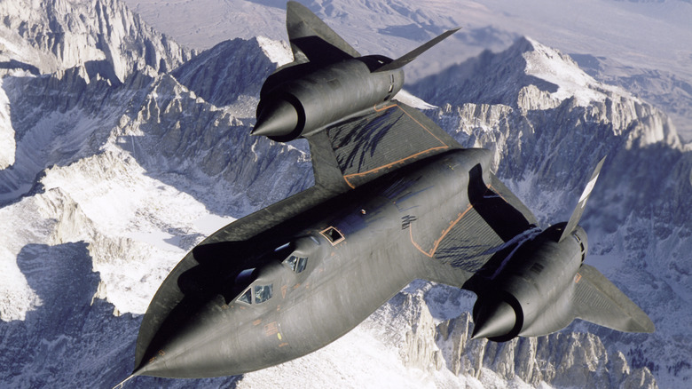 An SR-71 Blackbird flying over California's mountains during a Mach 3.0 test flight in 1995