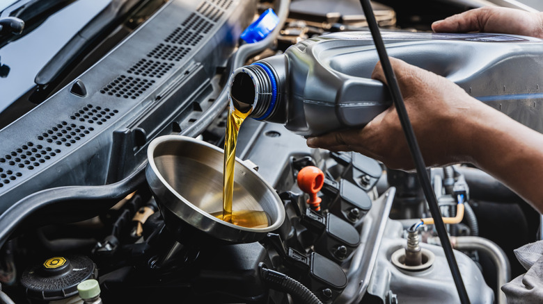 New engine oil being added during a service