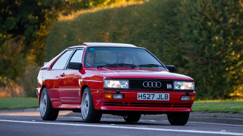 Red 1991 Audi S2 on country road