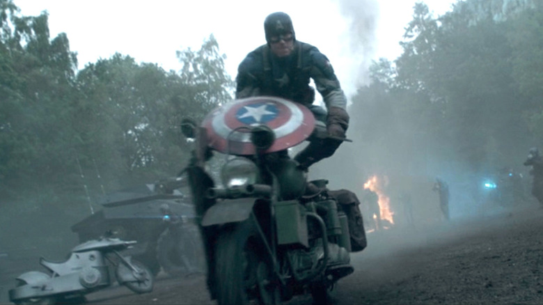 Captain America jumping off of Harley-Davidson motorcycle