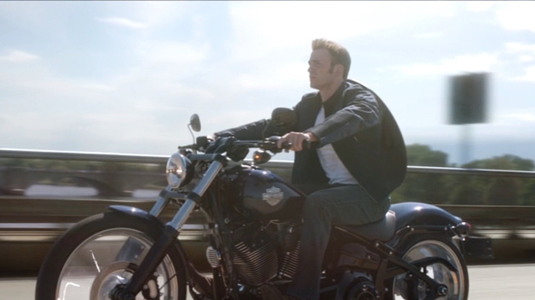 Captain America riding a Harley-Davidson motorcycle