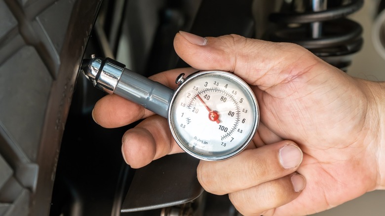 Checking motorcycle tire pressure