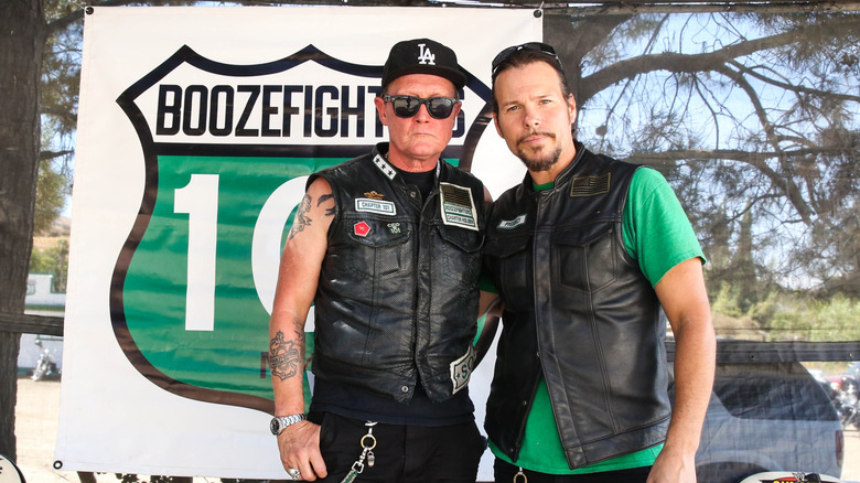 Actor Robert Patrick, left, and former Dokken bassist Sean McNabb in front of a Boozefighters banner in 2017