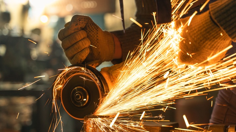 Angle grinder in use with sparks flying.