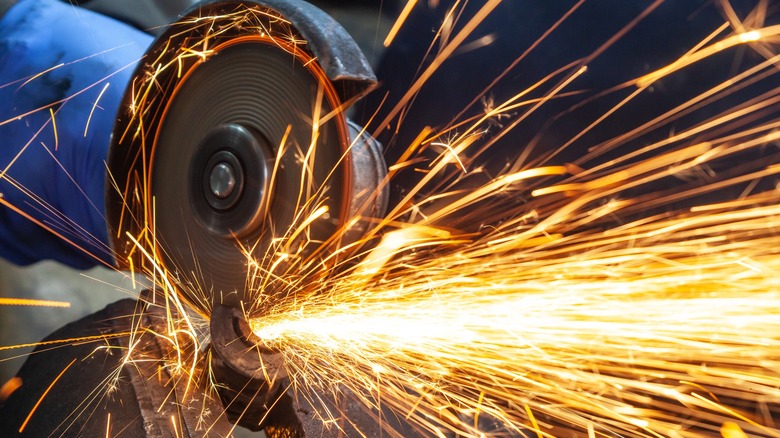 Angle grinder disc in use with sparks