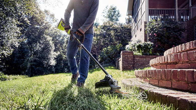 man trimming near stairs