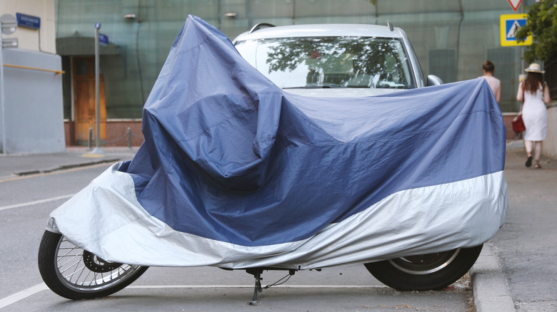 Motorcycle parked with cover