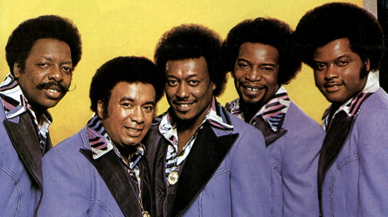 The Spinners wearing costumes