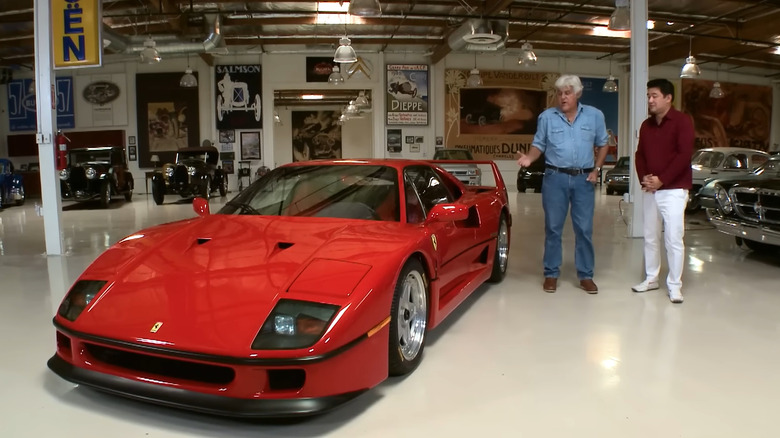 Jay Leno and David Lee next to Ferrari F40