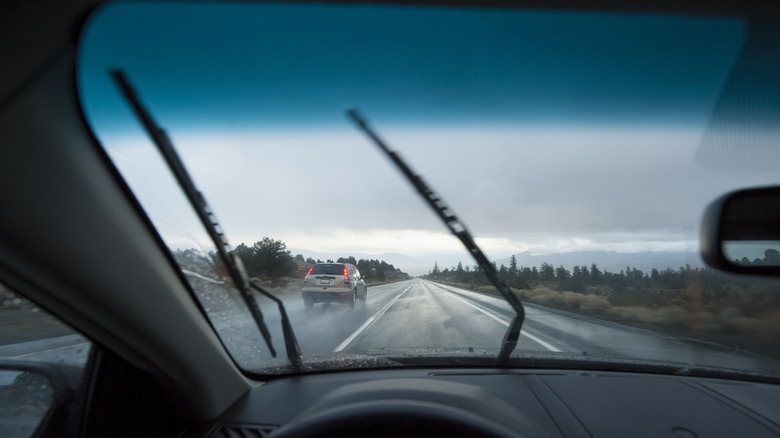 View from the inside of a car showing the front windshield with a darker tint on top