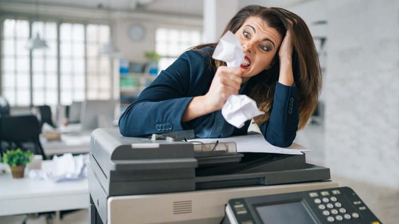 woman frustrated by printer