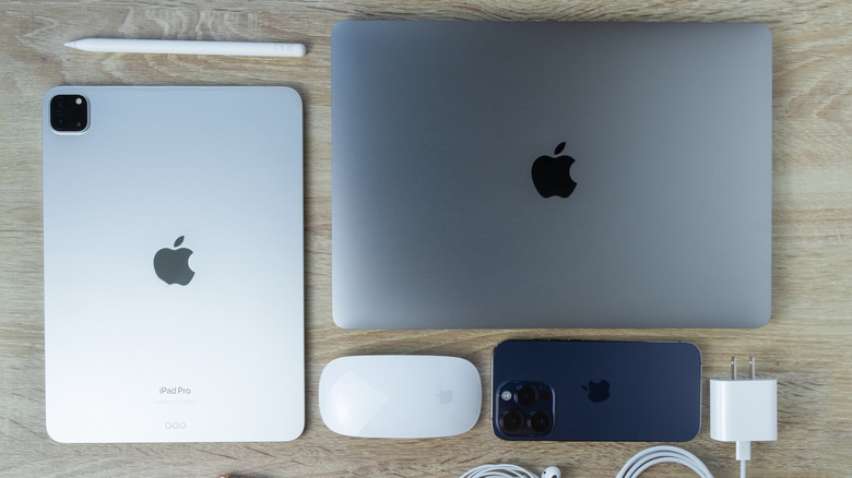 Several Apple products on wood table