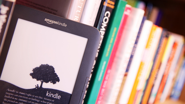 Amazon Kindle on bookshelf