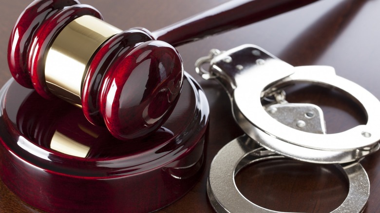 Gavel and handcuffs on a table