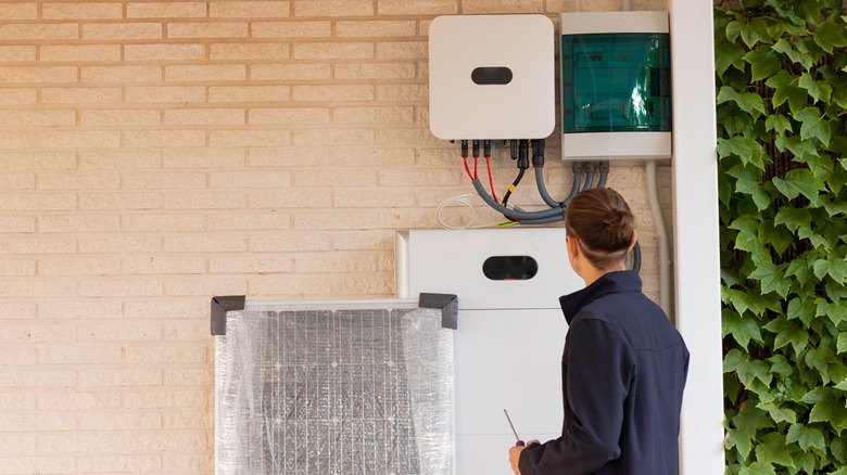 Worker installing solar system