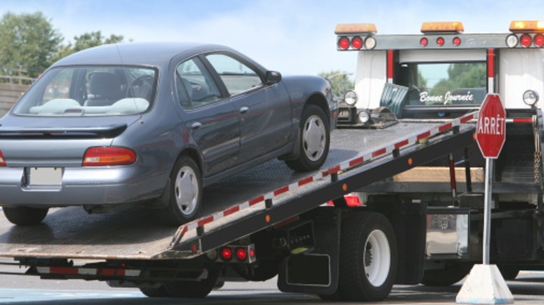 A car on a towing truck