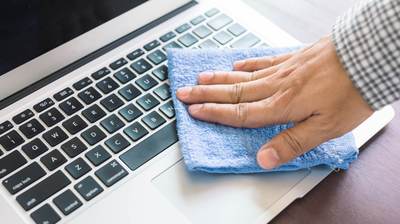 Drying laptop keyboard with towel