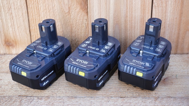 three Ryobi batteries in a row