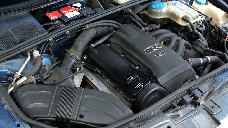 The engine bay of an Audio car with a 1.6-liter engine