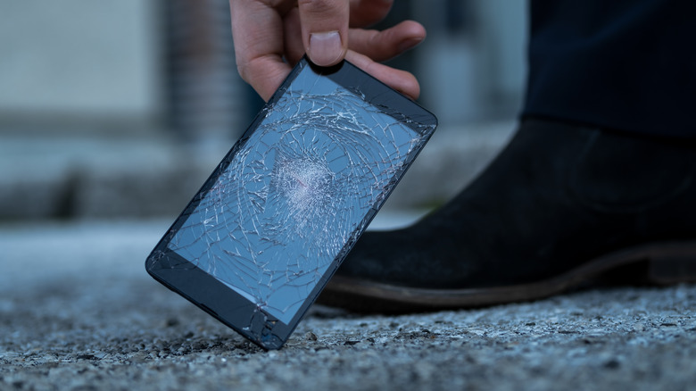 Broken phone against ground