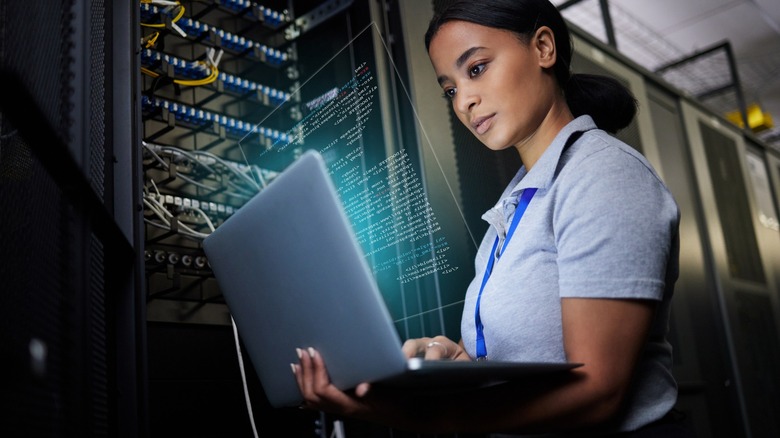 Woman working laptop server