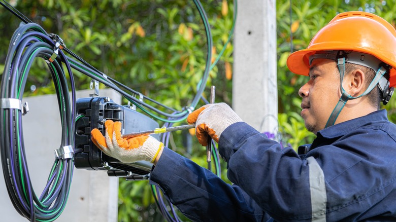 Engineer working on fiber cable