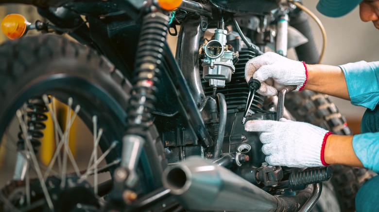 Motorcycle mechanic doing a repair