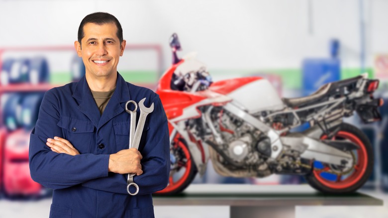 Motorcycle mechanic with wrench