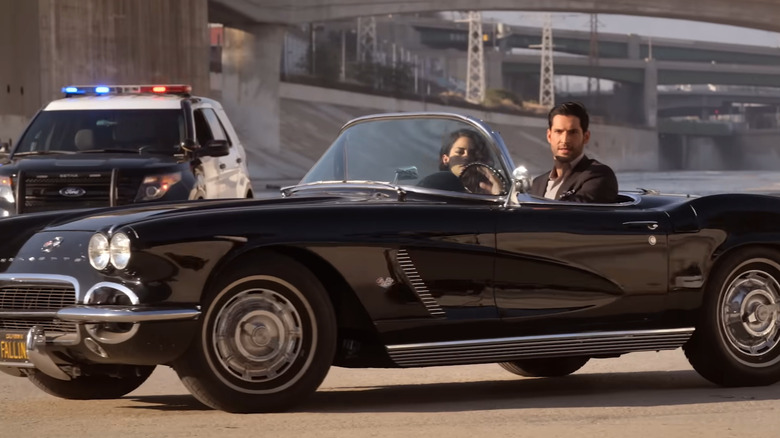 Tom Ellis as Lucifer Morningstar driving at night in a 1962 Corvette C1