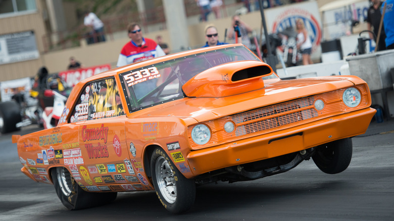 S/G class 1968 Dodge Dart launching on the drag strip