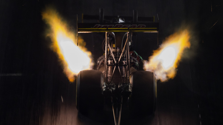 "Rooster tail" nitromethane exhaust of top-fuel dragster at full throttle