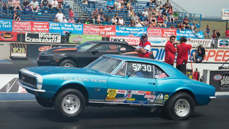 E/S class 1967 Chevrolet Camaro SS doing a wheelie off the line at the drag strip