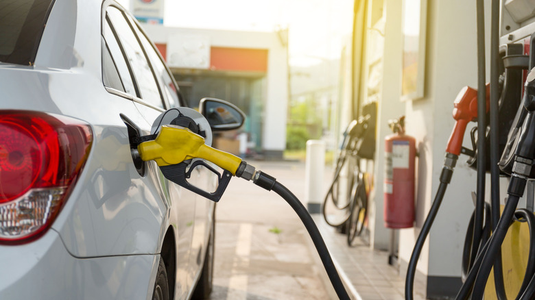 Car being refueled at gas pump