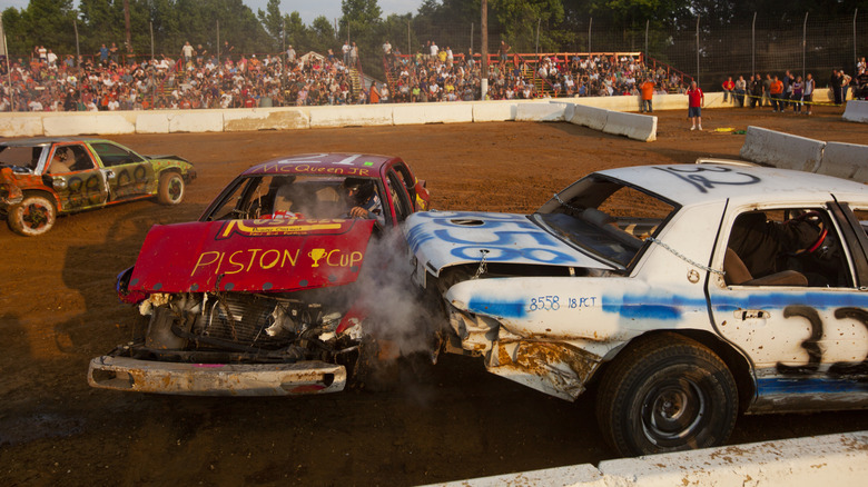 Cars crash into each other in cloud of dust and smoke at Demolition Derby at Potomac Speedway