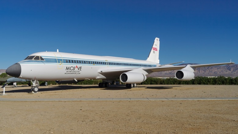 Convair 990 in dirt field