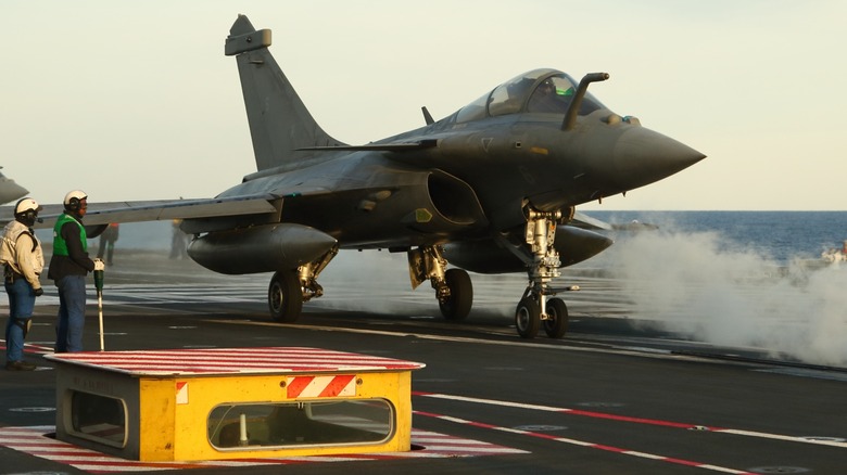 Aircraft preparing for takeoff on aircraft carrier