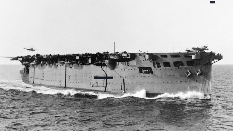 HMS Argus at sea with plane inbound