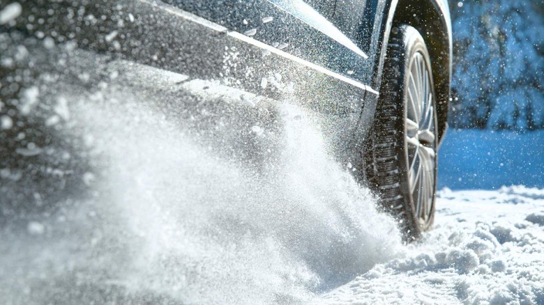 Snow flying from a tire