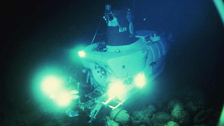 Submersible on sea floor with lights